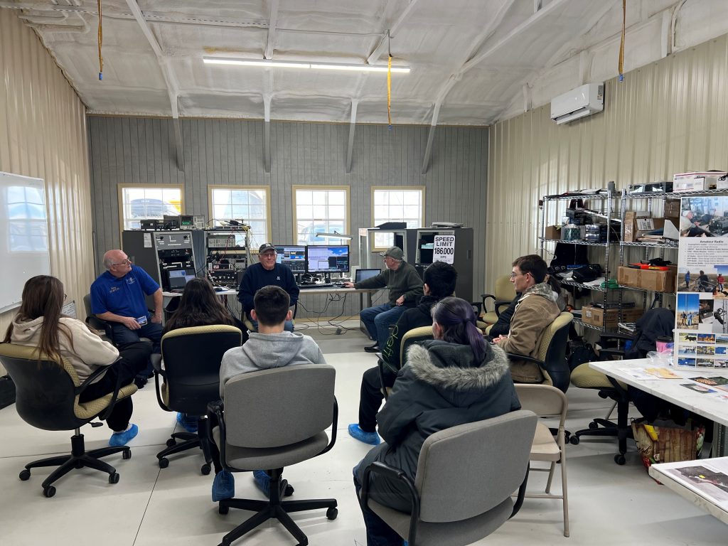 Students from Las Animas High school conversing with members of the Deep Space Exploration Society (DSES) on their visit to the Plishner Radio Astronomy and Space Sciences Center.