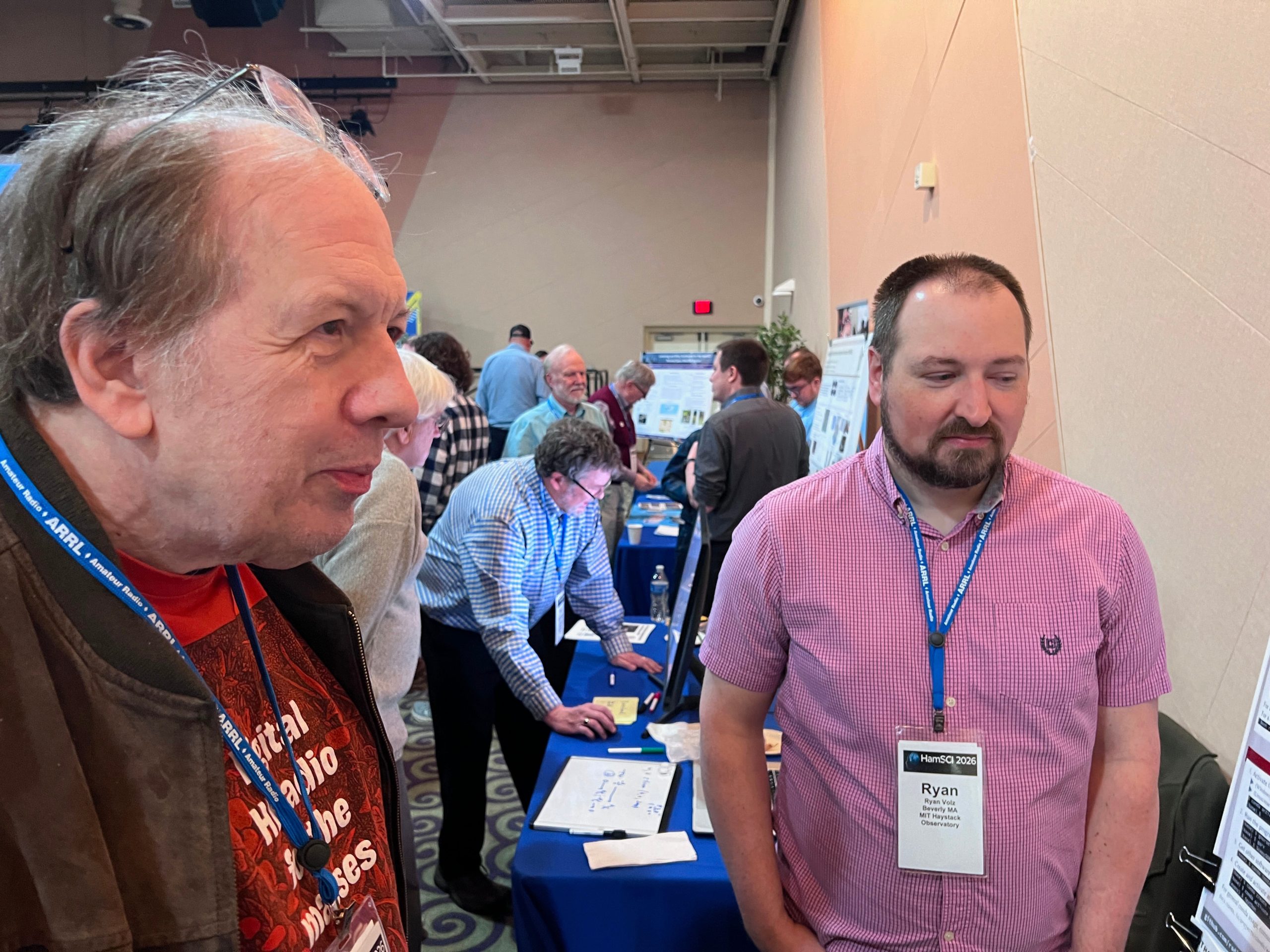 Phil Karn KA9Q talking to Ryan Volz about Radioconda at the HamSCI Workshop 2026 Poster Session. Image credit: Steve Stroh N8GNJ.