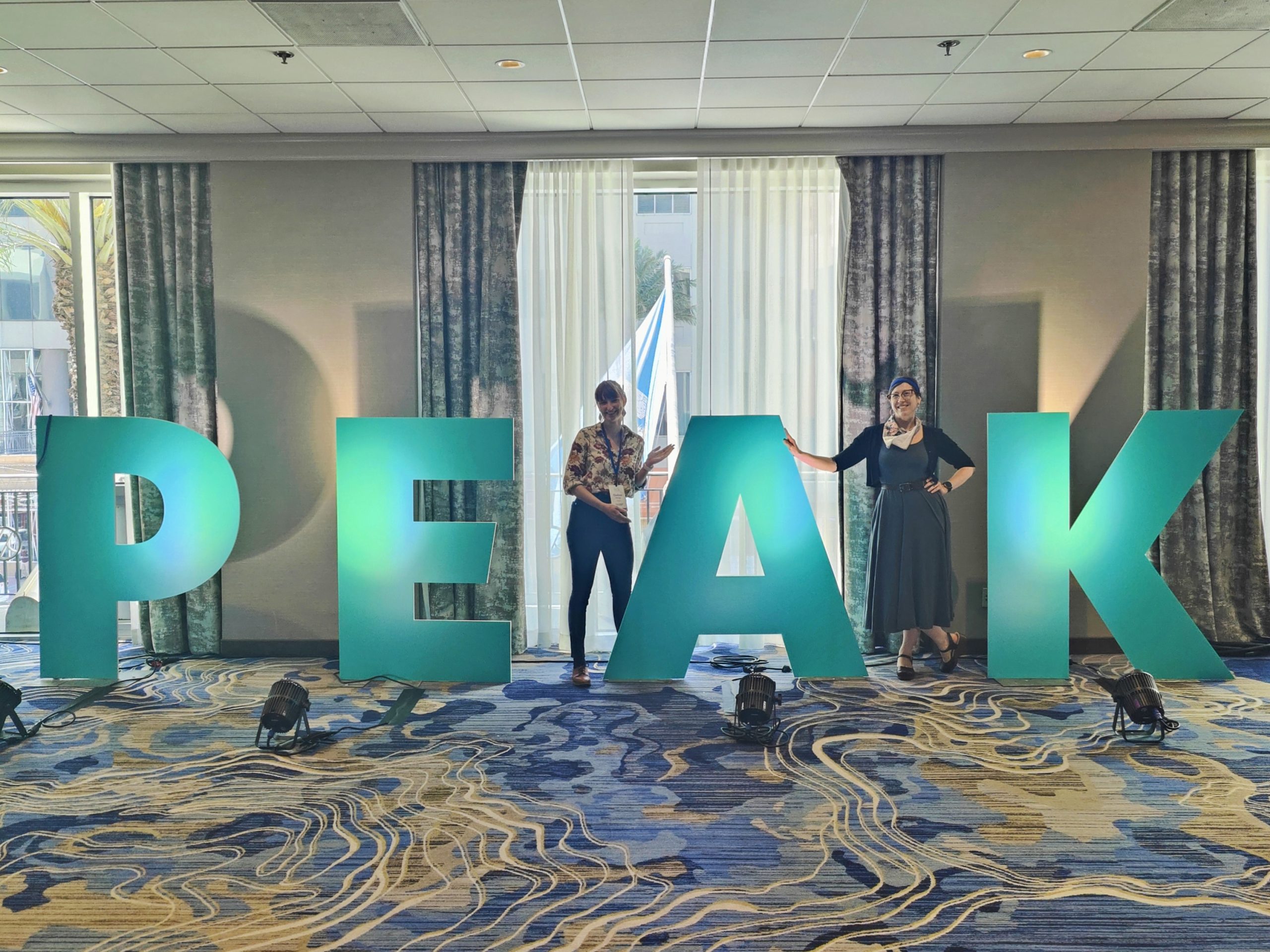 Director of Grantmaking Chelsea Párraga KF0FVJ and Executive Director Rosy Schechter KJ7RYV at Principles Equity Advocacy Knowledge (PEAK) Grantmaking