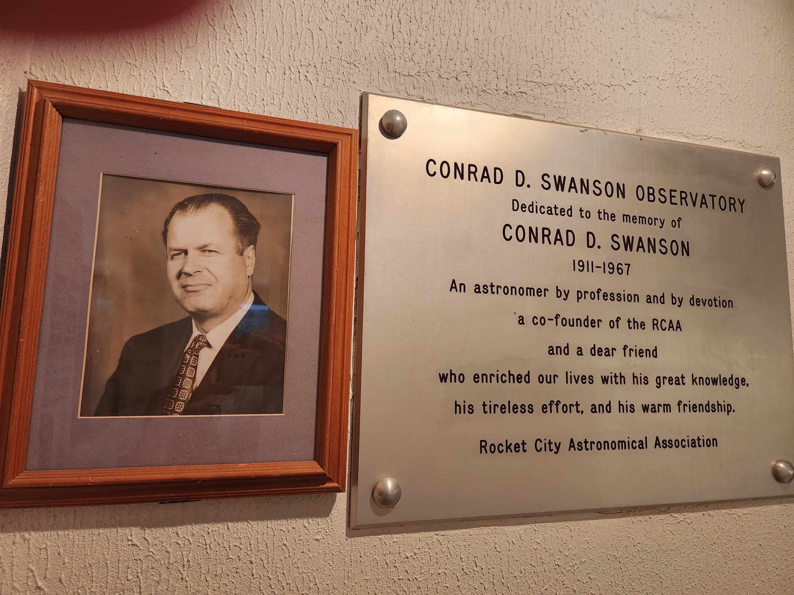 Photograph and plaque inside Swanson Observatory commemorating Conrad D. Swanson
