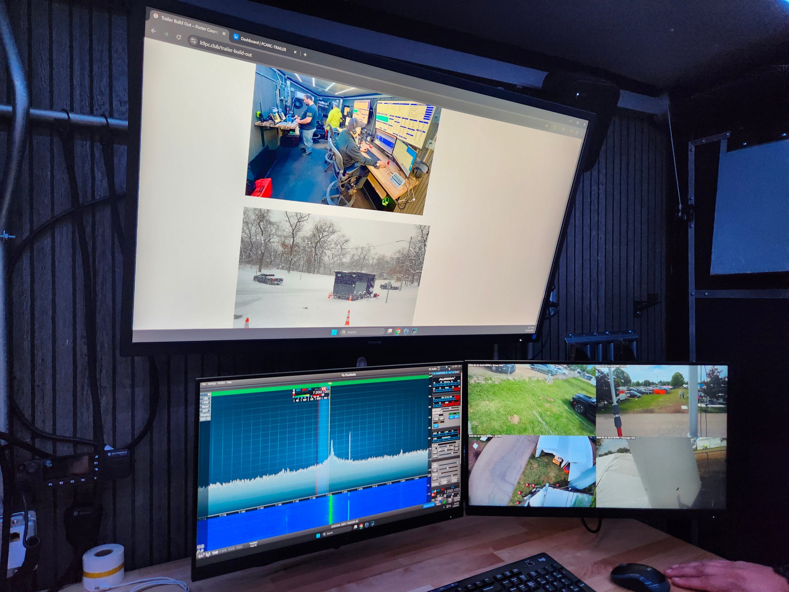 A 3-monitor workstation inside of the Portal County Amateur Radio Club's K9PC trailer, Hamvention 2026