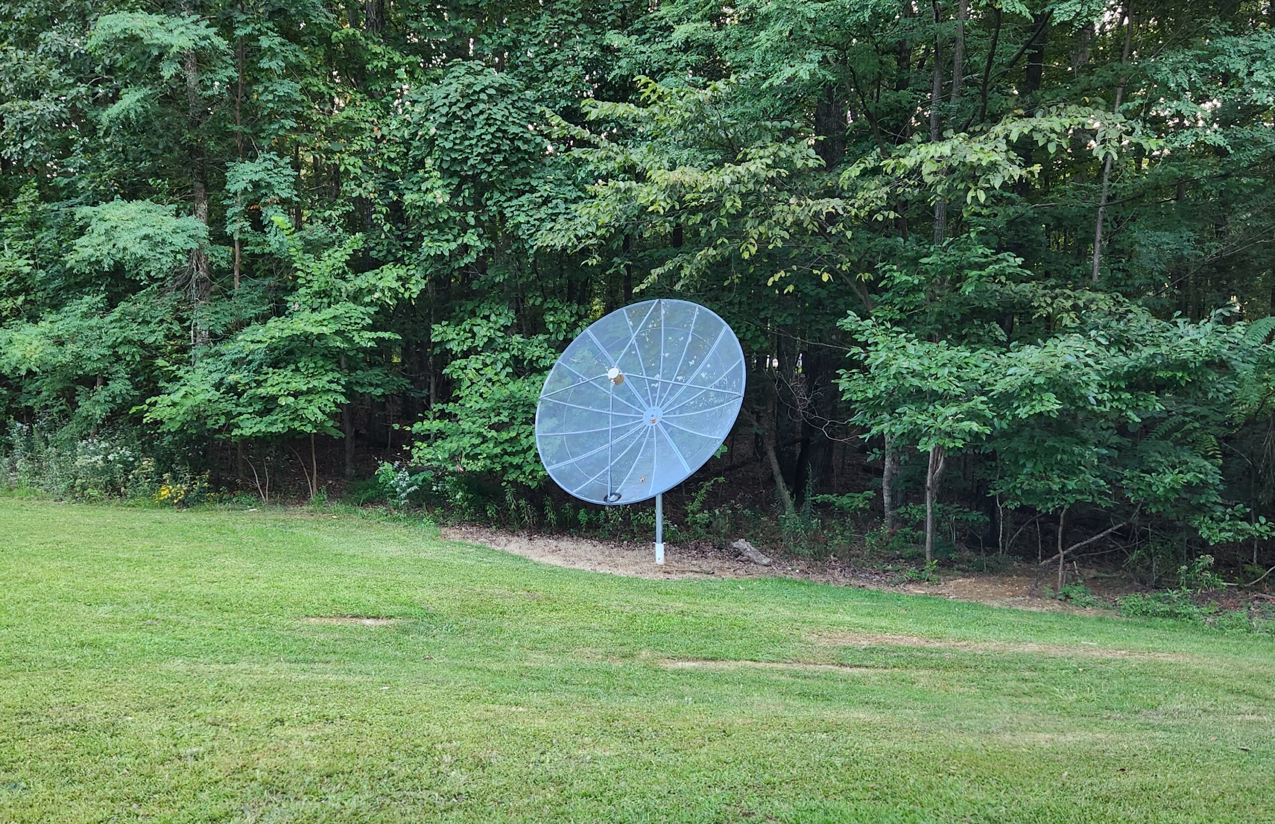 Satellite dish located in a field at the Von Braun Astronomical Society (VBAS)
