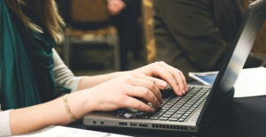 Person typing on a laptop